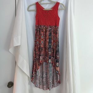 Girl’s red-orange patterned dress